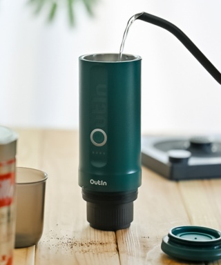 OutIn Teal Nano espresso machine in use